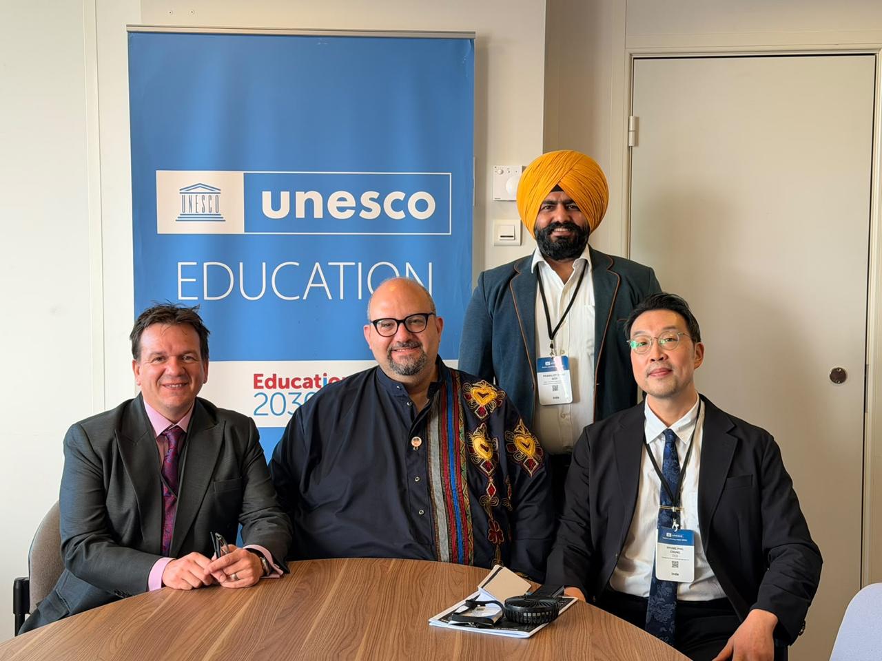 From left to right: Ben Gudgeon - Senior Director ( IFIP ) Daniel Sobel - Founder and Chair ( IFIP ) Phil Chung ( CEO : Kinexin Convention Management ) behind them, Prabhjot Singh Bedi ( Head Convention Sales  : Kinexin Convention Management )
