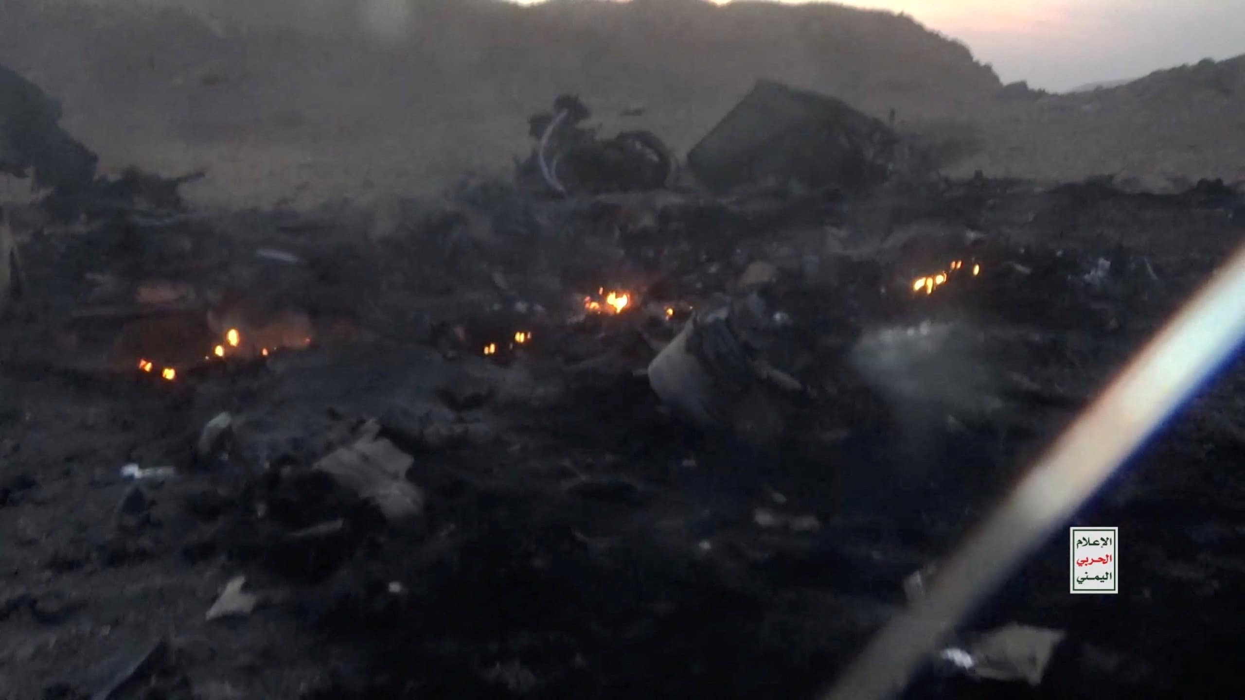 Burning debris from the wreckage of what the Houthi military media wing says is a downed Saudi jet, at a location given as Yemen, in this still image from a handout video released on September 16, 2026. Houthi Military Media/Handout via REUTERS