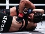 India’s Ritu Phogat (top) fights Nam Hee Kim of South Korea during the 2019 One Championship in Beijing. (Getty Images)