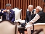 Prime Minister Narendra Modi is seen sitting with Russian President Vladimir Putin and Chinese President Xi Jinping, as they seemingly sip tea together while engaged in a conversation during BRICS.