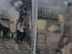 A video of the incident shows the couple sitting beside the barbecue before the situation suddenly escalates. 
