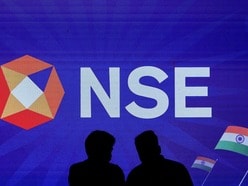 FILE PHOTO: People talk inside the National Stock Exchange (NSE) in Mumbai, India, August 14, 2025. REUTERS/Francis Mascarenhas/File Photo