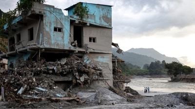Residents walk through debris on the 15th day after the devastating flash flood and mudslide, at Devighat in Nuwakot, Nepal, Monday, Sept. 7, 2026. (PTI) Residents walk through debris on the 15th day after the devastating flash flood and mudslide, at Devighat in Nuwakot, Nepal, Monday, Sept. 7, 2026. (PTI)