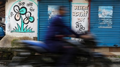 A TMC symbol graffiti drawn on a wall at Kalighat, in Kolkata. (PTI Photo)