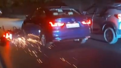 Bike dragged under car in Delhi's RK Puram. (Screengrab/HT video) Bike dragged under car in Delhi's RK Puram. (Screengrab/HT video)