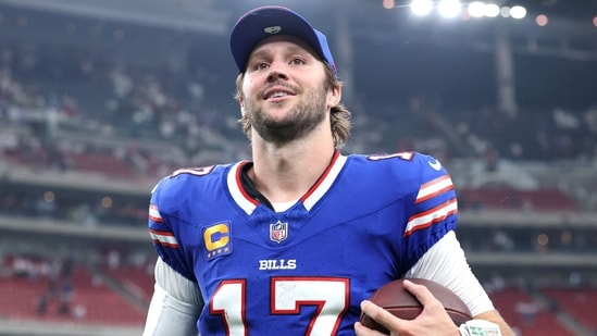 Josh Allen is the Bills quarterback, 2024 NFL MVP, $330 million contract holder, and husband of Hailee Steinfeld.(Photo by Tim Warner / GETTY IMAGES NORTH AMERICA / Getty Images via AFP)(Getty Images via AFP)