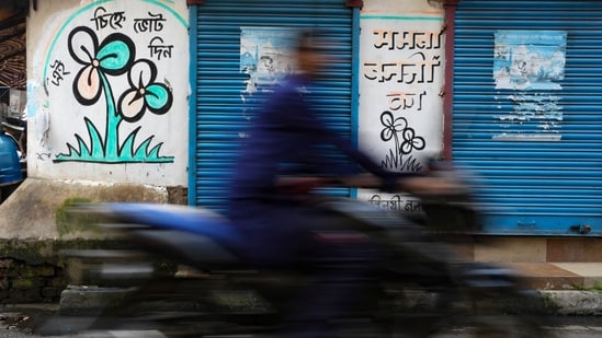 A TMC symbol graffiti drawn on a wall at Kalighat, in Kolkata. (PTI Photo)