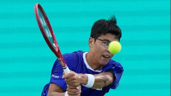 South Korea's Hyeon Chung returns the ball to India's Sumit Nagal during the Davis Cup second round qualifier match against India. (AP Photo)