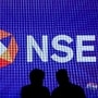 FILE PHOTO: People talk inside the National Stock Exchange (NSE) in Mumbai, India, August 14, 2025. REUTERS/Francis Mascarenhas/File Photo