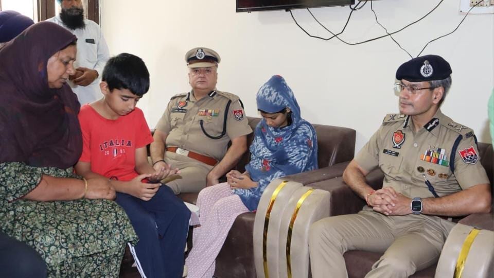 Punjab Police chief Gaurav Yadav and commissioner of police Harmanbir Singh Gill with family members of ASI Harjit Singh in Amritsar on Friday. (HT Photo) Punjab Police chief Gaurav Yadav and commissioner of police Harmanbir Singh Gill with family members of ASI Harjit Singh in Amritsar on Friday. (HT Photo)
