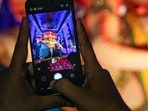A person takes a picture of an idol of Lord Ganesh at a 'pandal' during 'Ganesh Chaturthi' celebrations, in Mumbai, Maharashtra. 