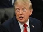 US President Trump signs H-1B order targeting employers over layoffs of US workers.