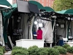 CNN Senior White House Correspondent Kristen Holmes waits to appear on-air from the CNN position on Pebble Beach, where television networks broadcast from the North Lawn of the White House ((Photo by SAUL LOEB / AFP))