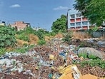 Waste dumped near Guru Nanak Public School at Model Town Extension in Ludhiana on Friday. (Gurpreet Singh/ht)