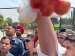 BJP's Ravneet Singh Bittu waving a packet of tomatoes and eggs at CM Mann's convoy