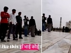 Photographer calls out men eyeballing a foreign tourist during a photoshoot at the Taj. 