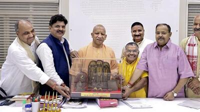 Chief minister Yogi Adityanath meets the chairman and officials of the Uttar Pradesh Go Seva Ayog (Cow Service Commission) on Saturday. (PTI PHOTO) Chief minister Yogi Adityanath meets the chairman and officials of the Uttar Pradesh Go Seva Ayog (Cow Service Commission) on Saturday. (PTI PHOTO)