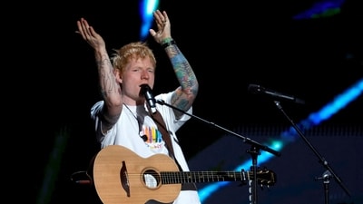 Ed Sheeran performs tonight with no support acts after Macklemore exit; resale tickets drop to $42. (Reuters)