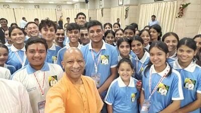 Uttar Pradesh chief minister Yogi Adityanath with students in Lucknow on Saturday. (SOURCED IMAGE)