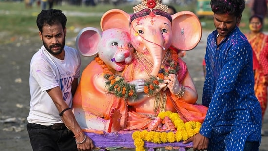 Gram it: As Ganpati celebrations continue, several devotees are taking to ghats to immerse the idol of Lord Ganesha in dedicated water bodies. Here's how this idol in Noida was carried for immersion in the Yamuna river, after devotees offered prayers on the fifth day of the festivities.(Photo: Sunil Ghosh/HT)