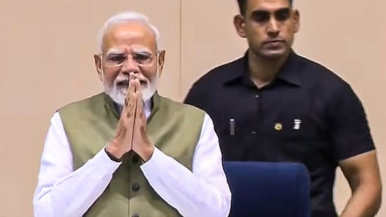 Prime Minister Narendra Modi greets the gathering during the inauguration of the International Conference on "The Future of Environment and Climate Dynamics", at Vigyan Bhawan, in New Delhi.
