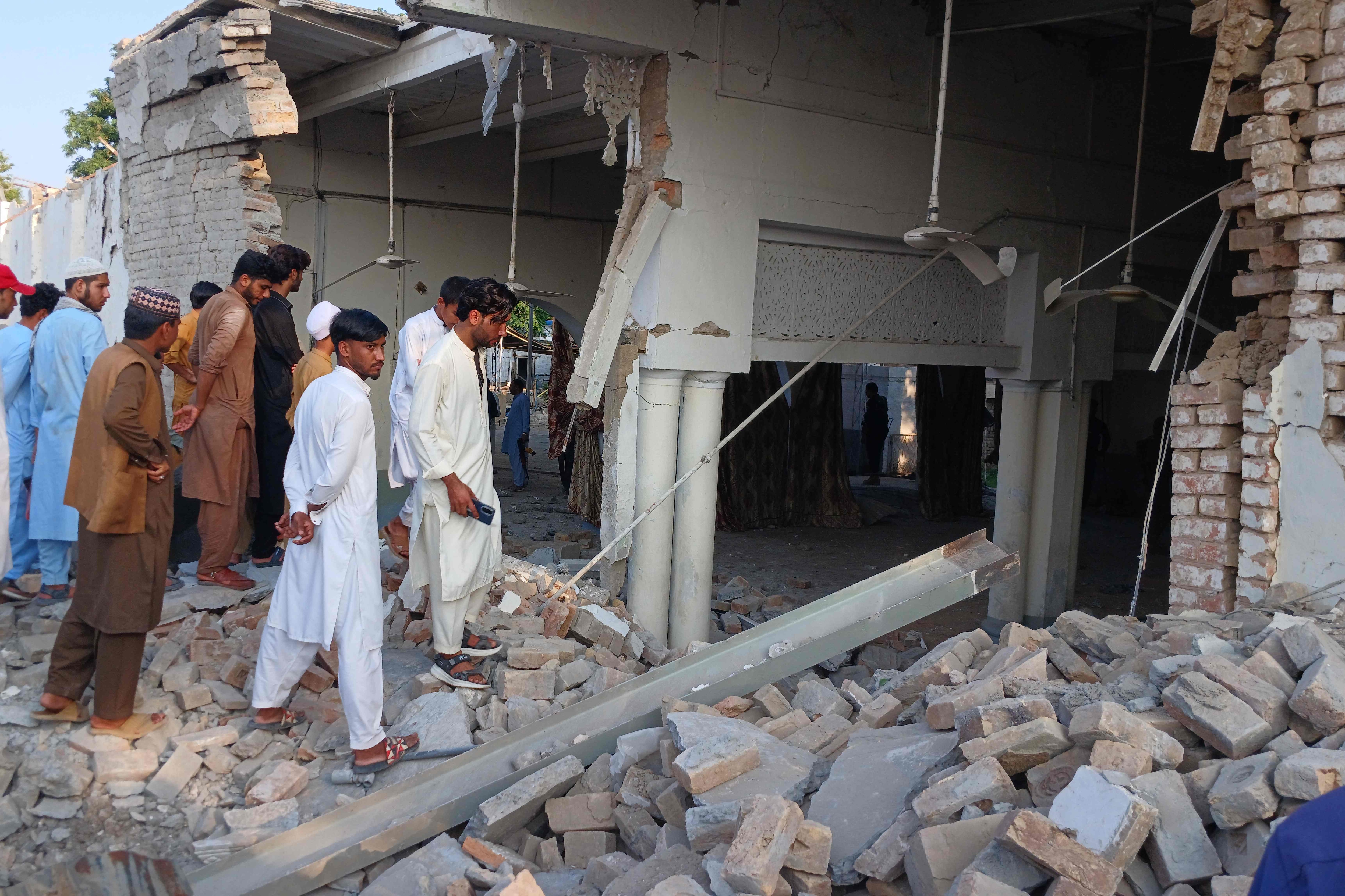 Onlookers gather at the site of an explosion inside the police headquarters at Kohat in Pakistan's Khyber Pakhtunkhwa province on September 18, 2026 (AFP) Onlookers gather at the site of an explosion inside the police headquarters at Kohat in Pakistan's Khyber Pakhtunkhwa province on September 18, 2026 (AFP)
