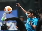 India's Quimcy Joaquim Dsouza kicks the ball during the women's singles bronze-medal teqball match against Japan's Yuina Sakamoto at the 20th Asian Games in Nagoya, Japan, Sept. 20, 2026. 