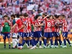 Atletico Madrid players celebrate their fiery derby win over Real Madrid