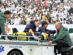 Jayden Reed of the Green Bay Packers is taken off the field due to an injury against the New York Jets.