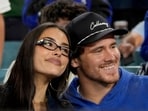 FILE - Los Angeles Chargers quarterback Justin Herbert and girlfriend Madison Beer watch the Toronto Blue Jays and the Los Angeles Dodgers compete during the seventh inning in Game 3 of baseball's World Series, Monday, Oct. 27, 2025, in Los Angeles. (AP Photo/Ashley Landis, File)(AP Photo/Ashley Landis)