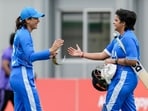 Shafali Verma, right, with Smriti Mandhana, celebrates her century during the second semifinal T20I cricket match between India's women and Bangladesh's women
