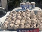 The Faridkot district police on Sunday busted a cross-border smuggling network with the arrest of four operatives, seizing 47.3 kg of heroin, three .30 bore pistols, three magazines, and 15 cartridges. (HT Photo)