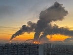 Plumes of smoke rise from fires (centre) at an oil refinery following what the authorities say is a Ukrainian drone strike in the course of the Russia-Ukraine conflict, in Moscow
