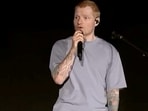 Singer Ed Sheeran speaks on stage as he addresses a controversy over Macklemore being pulled from the tour after saying "Free Palestine" at a show.