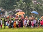 People carry idols of Lord 'Ganesh' for immersion during the 'Gauri Ganpati Visarjan' procession. People carry idols of Lord 'Ganesh' for immersion during the 'Gauri Ganpati Visarjan' procession.