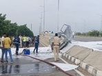The neurosurgeon's car was left engulfed in flames after it hit the iron grills of the road divider.