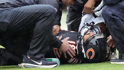 Chicago Bears quarterback Caleb Williams lies on the field after suffering hamstring injury. (AP Photo) Chicago Bears quarterback Caleb Williams lies on the field after suffering hamstring injury. (AP Photo)