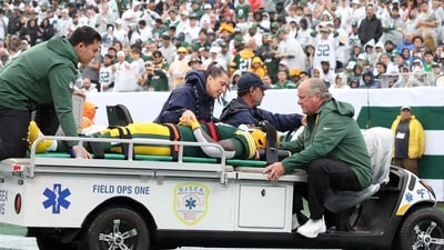 Jayden Reed of the Green Bay Packers is taken off the field due to an injury against the New York Jets. (Getty Images via AFP) Jayden Reed of the Green Bay Packers is taken off the field due to an injury against the New York Jets. (Getty Images via AFP)