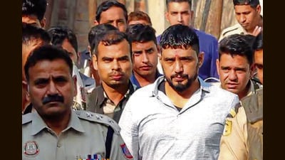 Gangster Sandeep, alias Kala Jathedi, arrives to take part in his daughters’ naming ceremony in Sonepat on Sunday. (HT Photo)