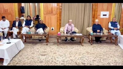 National Conference president Dr Farooq Abdullah and J&K CM Omar Abdullah preside over a meeting with party legislators in Srinagar on Sunday. (HT Photo)
