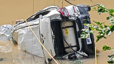 Rescue teams recovered the submerged vehicle after nearly four hours. (PTI) Rescue teams recovered the submerged vehicle after nearly four hours. (PTI)