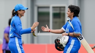 Shafali Verma, right, with Smriti Mandhana, celebrates her century during the second semifinal T20I cricket match between India's women and Bangladesh's women
