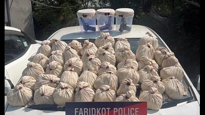 The Faridkot district police on Sunday busted a cross-border smuggling network with the arrest of four operatives, seizing 47.3 kg of heroin, three .30 bore pistols, three magazines, and 15 cartridges. (HT Photo) The Faridkot district police on Sunday busted a cross-border smuggling network with the arrest of four operatives, seizing 47.3 kg of heroin, three .30 bore pistols, three magazines, and 15 cartridges. (HT Photo)