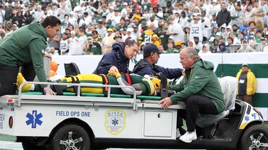 Jayden Reed of the Green Bay Packers is taken off the field due to an injury against the New York Jets.