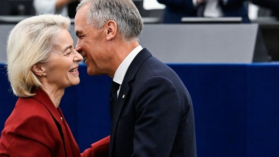 Canada's Prime Minister Mark Carney greets European Commission President Ursula von der Leyen after delivering a speech in the hemicycle at the European Parliament in Strasbourg, eastern France, on September 17, 2026.