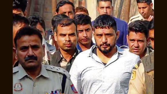 Gangster Sandeep, alias Kala Jathedi, arrives to take part in his daughters’ naming ceremony in Sonepat on Sunday. (HT Photo)