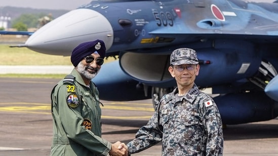 India's Chief of the Air Staff Amar Preet Singh (L) and Japan Air Self Defence Force (JASDF) Chief of Staff, General Takehiro Morita shake hands during a bilateral air exercise at Air Force Station in Jodhpur on September 20, 2026. (Photo by HIMANSHU SHARMA / AFP)