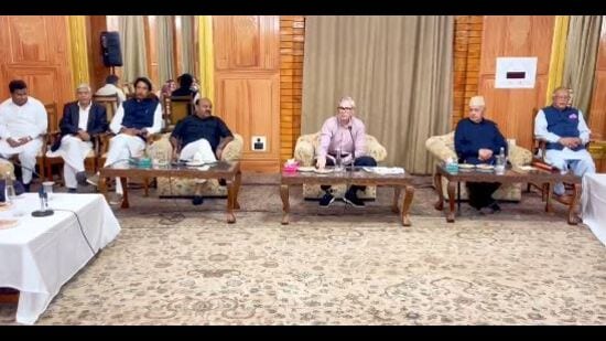 National Conference president Dr Farooq Abdullah and J&K CM Omar Abdullah preside over a meeting with party legislators in Srinagar on Sunday. (HT Photo)