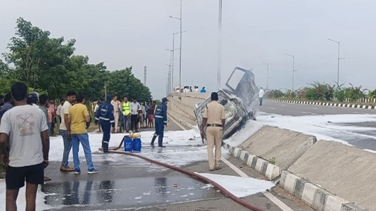 The neurosurgeon's car was left engulfed in flames after it hit the iron grills of the road divider.