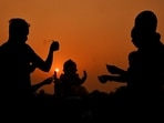 Gram it: Devotees offer prayers to Lord Ganesha before immersing an idol in the Yamuna river, on Sunday. The ongoing Ganeshotsav celebrations have taken over the city with much fervour.